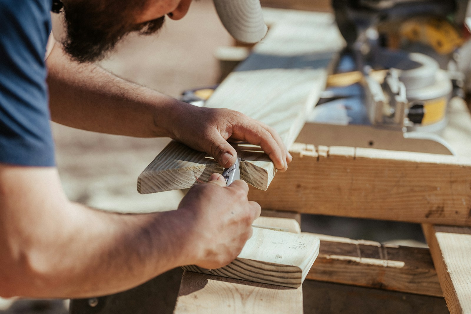 a man working on a piece of wood